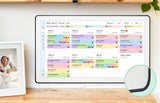 Color-coded weekly events organized on the Skylight 27-inch smart family calendar mounted on the wall.