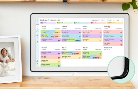 Color-coded weekly events organized on the Skylight 27-inch smart family calendar mounted on the wall.