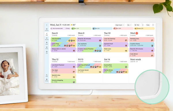 Color-coded weekly events organized on the Skylight 27-inch smart family calendar mounted on the wall.